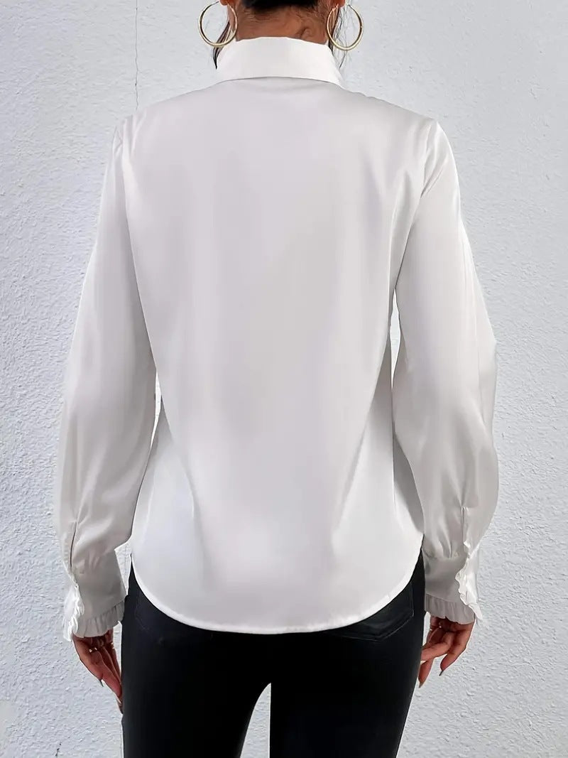 Stylish shirt with ruffled and layered design details.